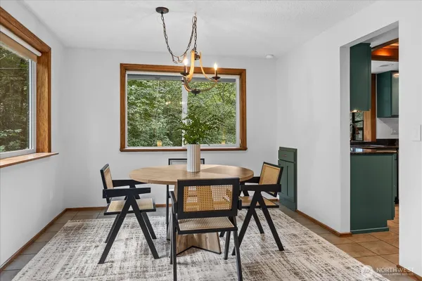a dining room with furniture and window