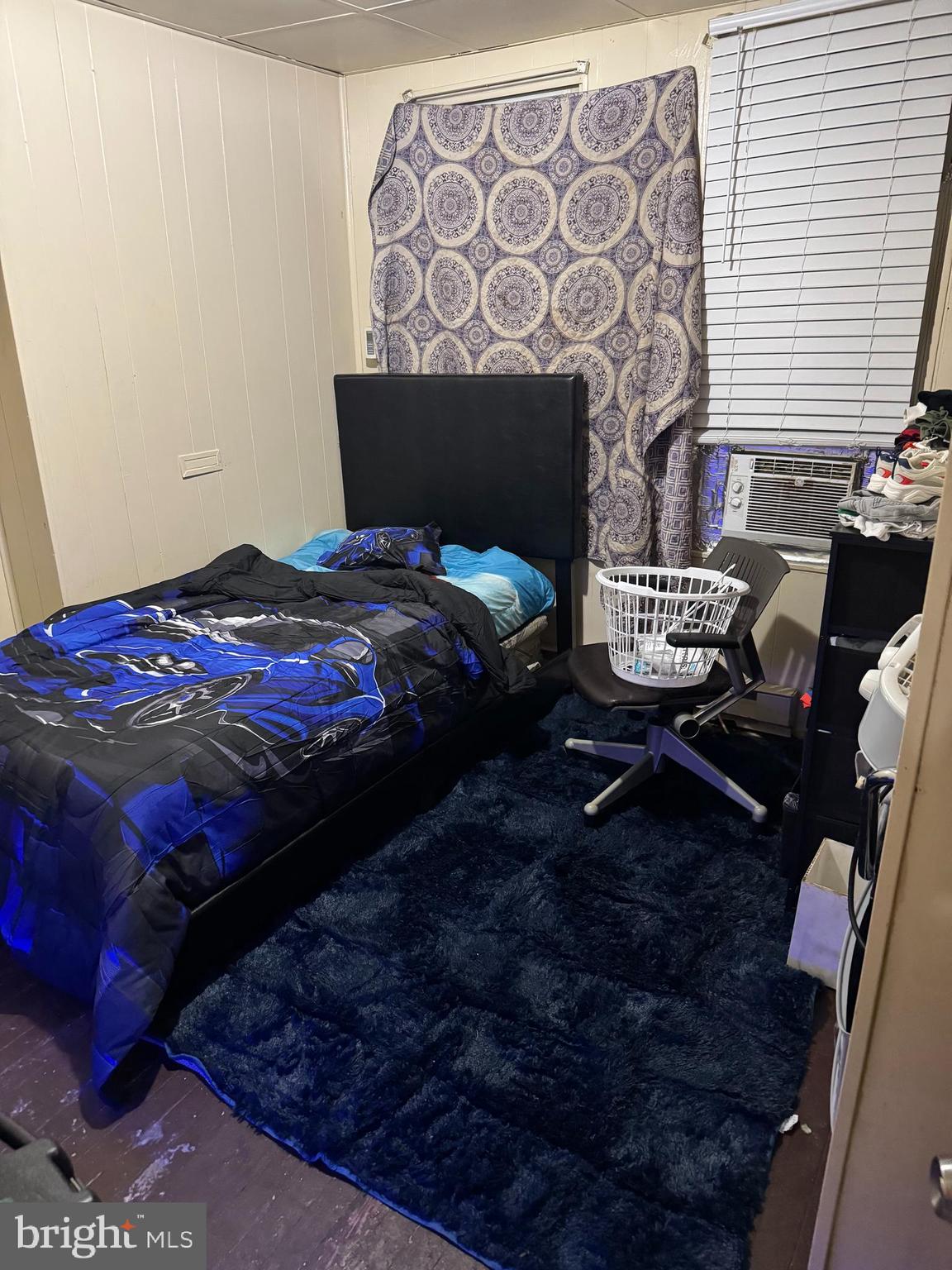 6356 Wheeler Street Philadelphia, PA 19142 - Photo 9 of 9 a bedroom with a bed and a lamp with the dresser