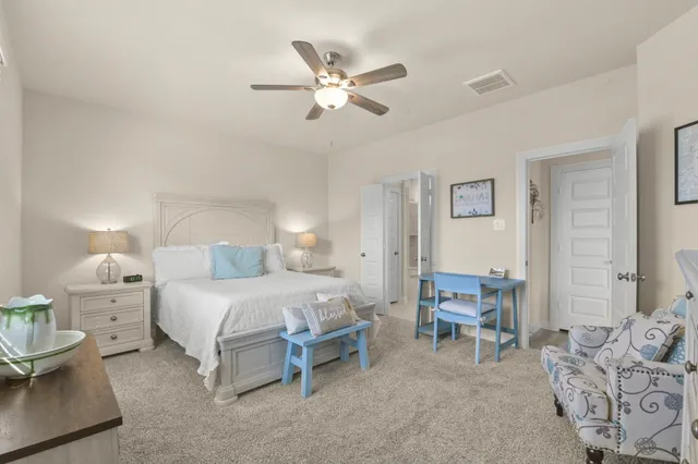 a bedroom with a bed and a dresser