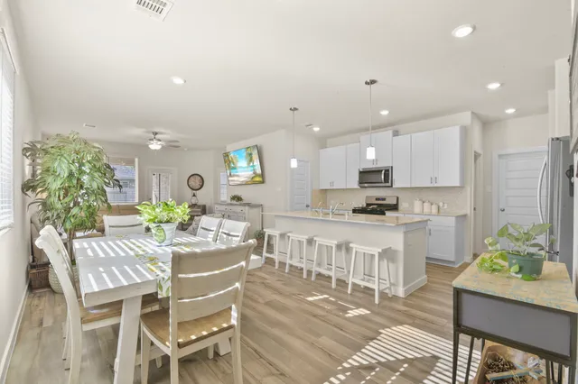 a dining room with furniture and window