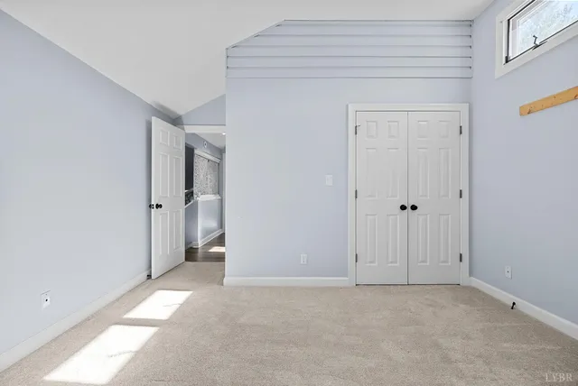 a view of a balcony with wooden fence