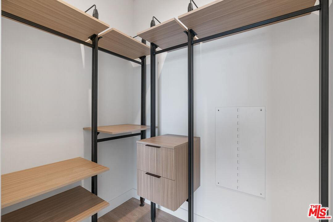 3688 Overland Avenue, Unit 521 Los Angeles, CA 90034 - Photo 11 of 31 a bathroom with a shower and a chair