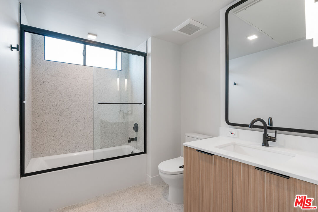 3688 Overland Avenue, Unit 521 Los Angeles, CA 90034 - Photo 8 of 31 a bathroom with a sink a toilet and shower