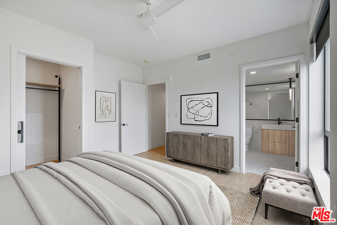 3688 Overland Avenue, Unit 521 Los Angeles, CA 90034 - Photo 10 of 31 a bedroom with a bed and a couch