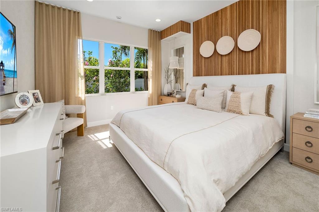 2687 Ridgecrest Place Naples, FL 34112 - Photo 6 of 7 a spacious bedroom with a bed and a window