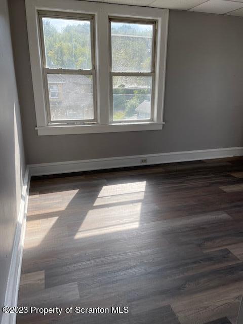 1225 South Main Street, Unit 6 Old Forge, PA 18518 - Photo 2 of 9 a view of empty room with wooden floor and fan