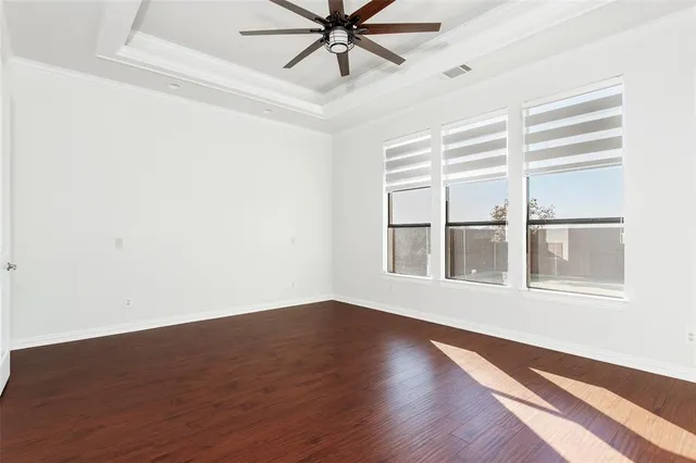 a view of livingroom with hardwood floor and ceiling fan