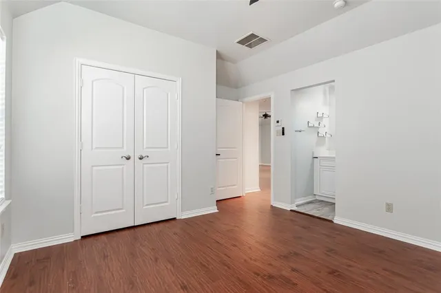 a bathroom with a shower sink and mirror