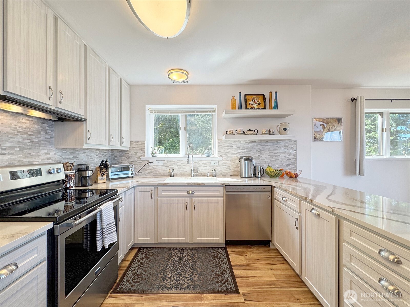 250 North Street, Unit A Sequim, WA 98382 - Photo 13 of 40 a kitchen with a sink stove and window