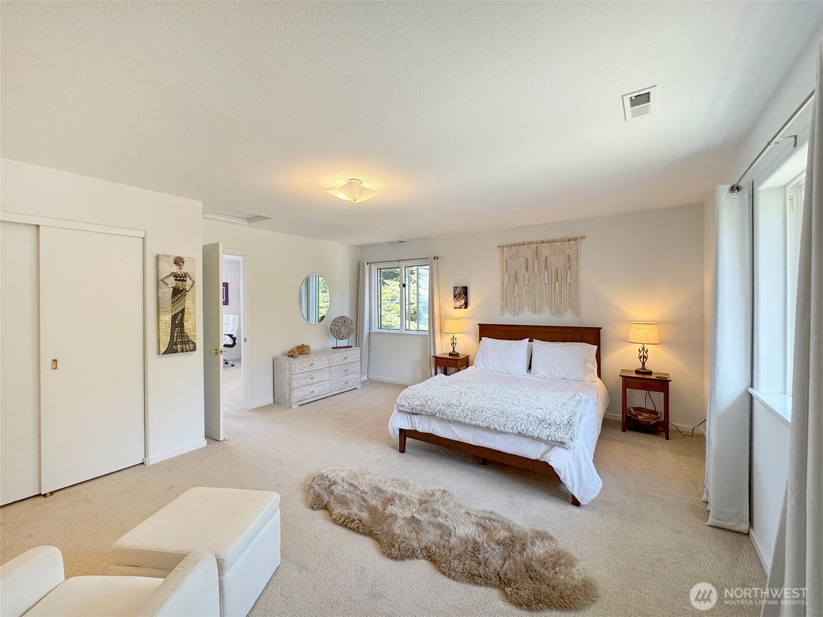 250 North Street, Unit A Sequim, WA 98382 - Photo 27 of 40 a bedroom with a bed couch and window