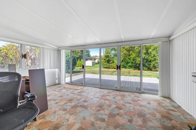 a view of a room with a large window