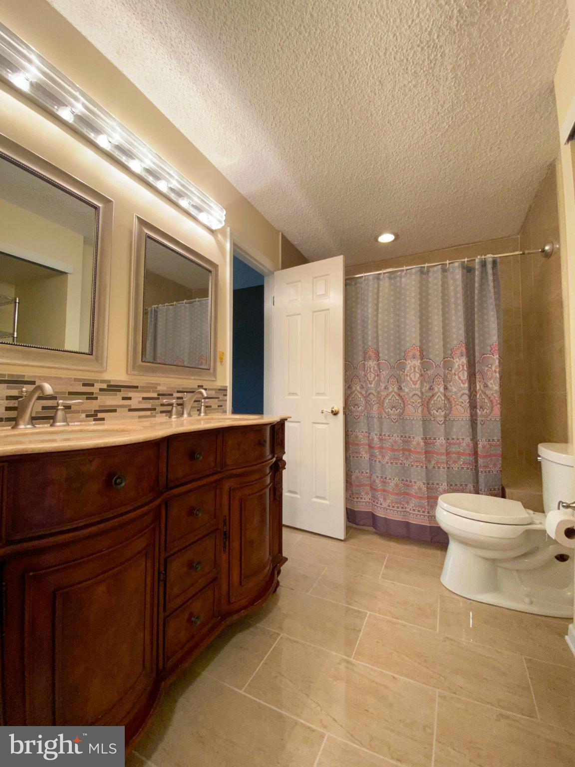 326 Brigade Court Chesterbrook, PA 19087 - Photo 25 of 48 a bathroom with a sink a toilet and mirror