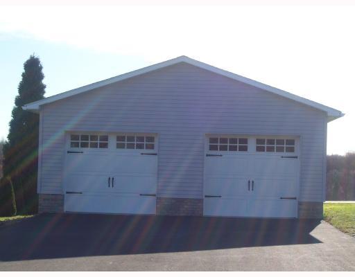Parking Lot/Garage. 2009 24X27 GARAGE WITH TWO AUTOMATED GARGAE DOOR OPENERS.