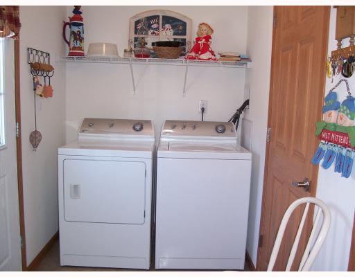 1st Floor Plan. THE DRYER AND WASHER STAYS.  THE LAUNDRY ROOM ALSO SERVES AS A MUDROOM OFF OF THE GARAGE.