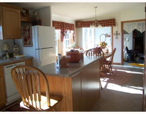 Kitchen. THE 15X13 EAT-IN-KITCHEN IS PEN AND SPACIOUS WHCH HAS THE COVERED PORCH THROUGH THE SLIDING GLASS DOORS. ALL APPLIANCES STAY, GREAT KITCHEN ISLAND AND THERE IS ALSO A PANTRY!