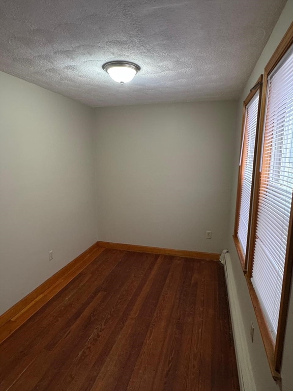 68 Maverick Street Chelsea, MA 02150 - Photo 12 of 16 wooden floor in an empty room with a window