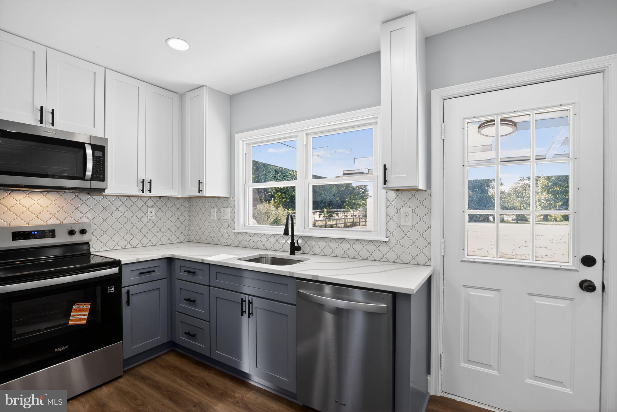113 Delight Road Owings Mills, MD 21117 - Photo 16 of 43 Quartz counters & door to yard & patio