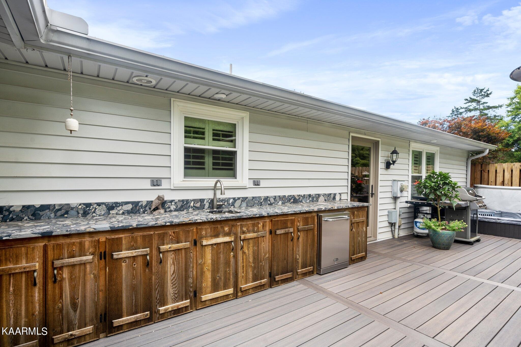 1309 Ridgeway Circle Athens, TN 37303 - Photo 31 of 48 a front view of a house with barbeque outdoor seating