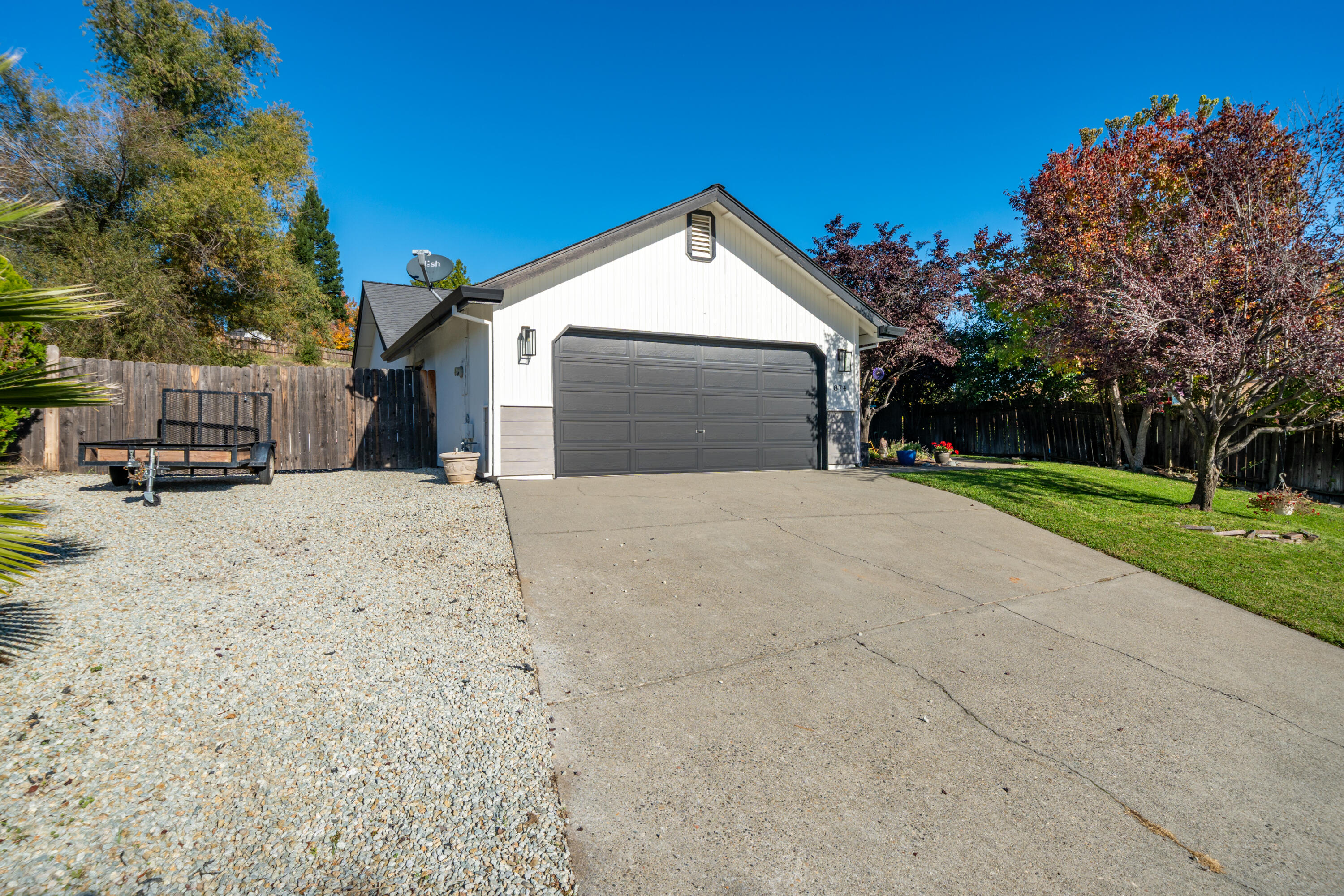 874 Spaniel Drive Redding, CA 96003 - Photo 3 of 41 a view of a house with a snow in the yard