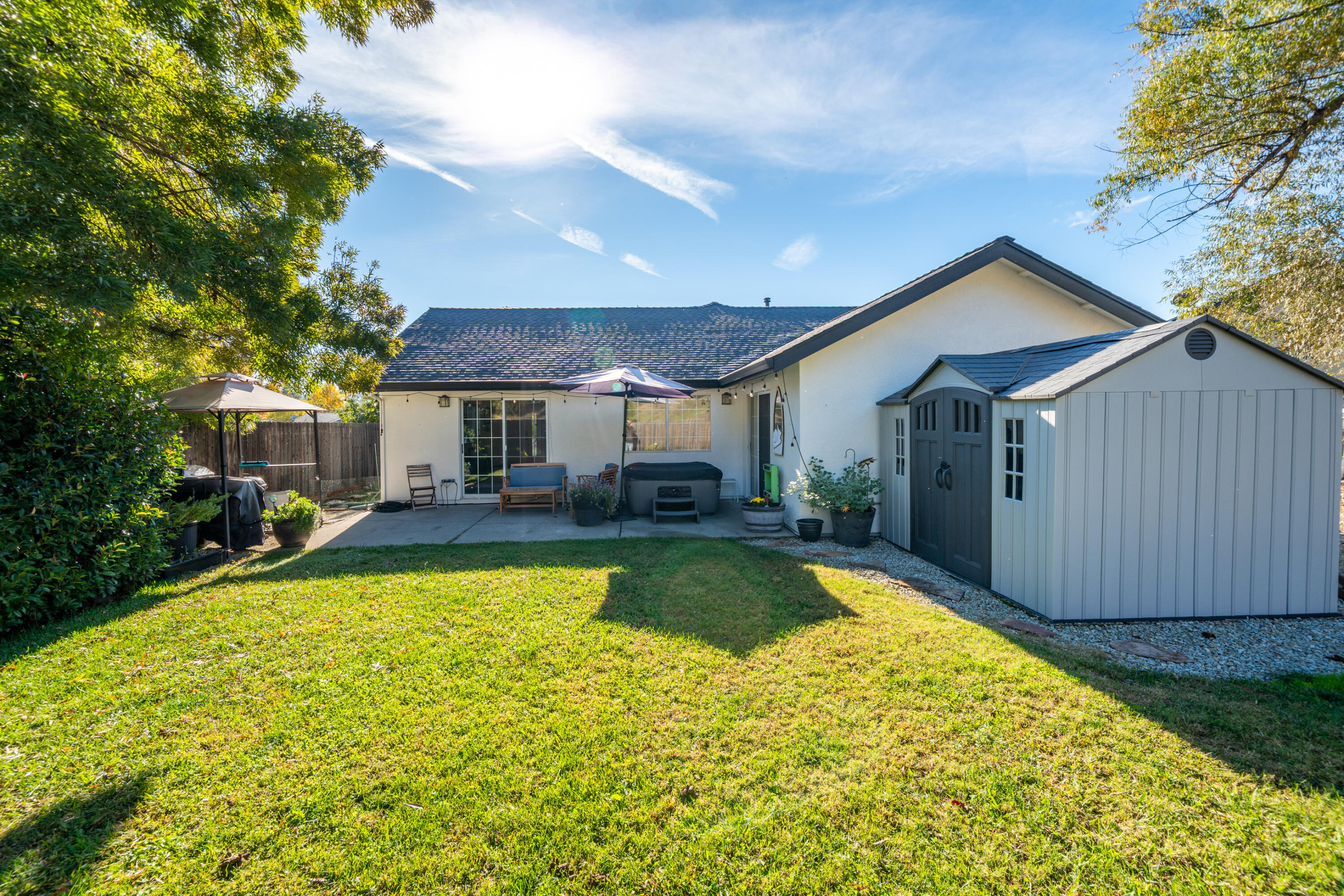 874 Spaniel Drive Redding, CA 96003 - Photo 36 of 41 a view of a house with swimming pool and sitting area