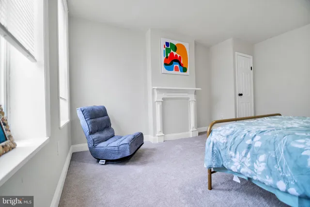 a bed room with a bed and a window