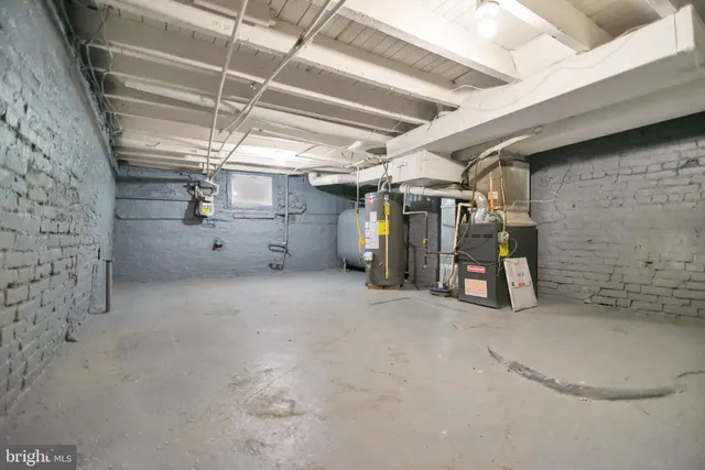 a view of empty room with wooden ceiling