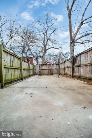 a view of outdoor space with wooden fence