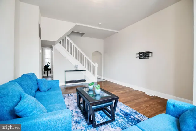 a living room with furniture and a table