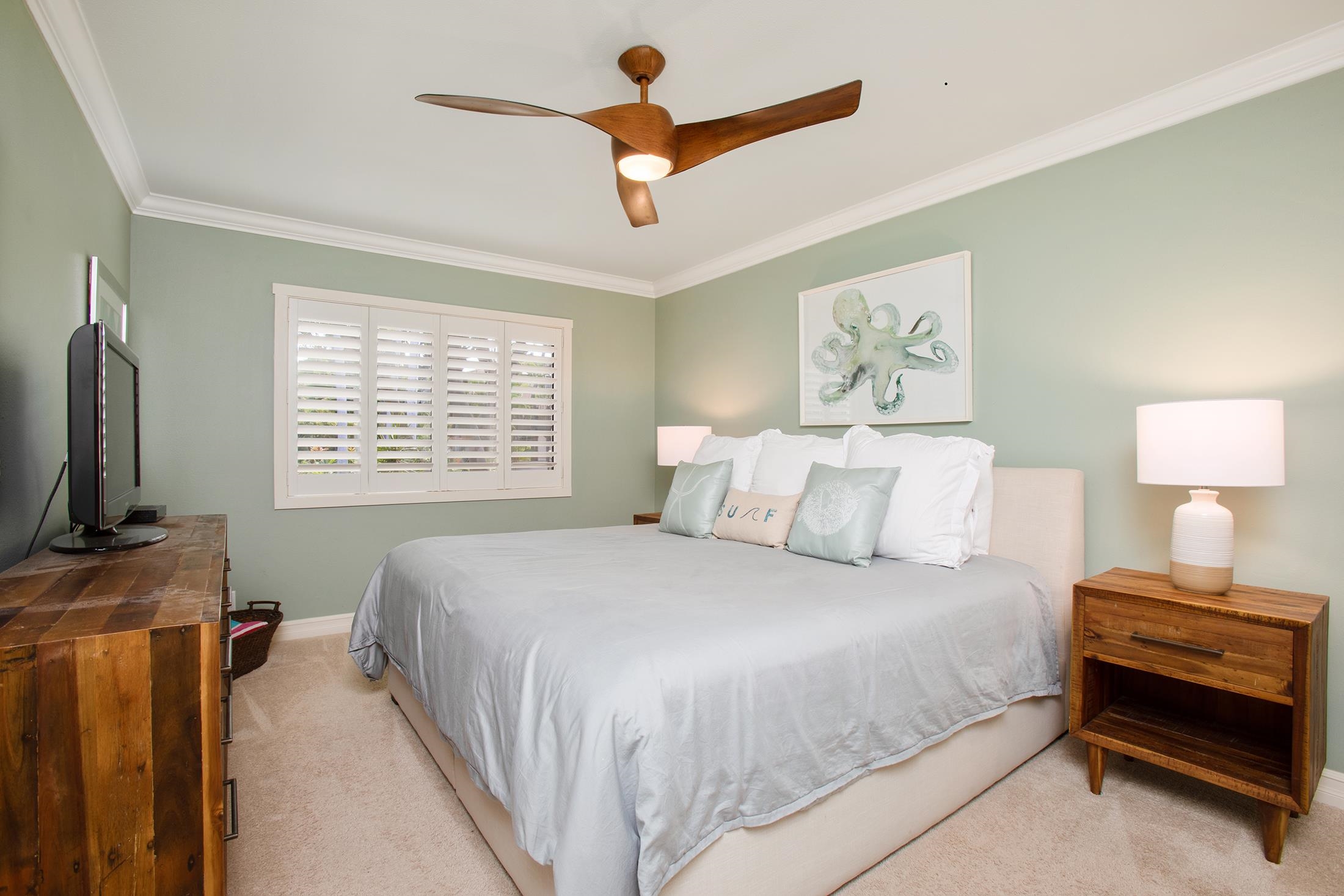4850 Makena Alanui Road, Unit F207 Kihei, HI 96753 - Photo 16 of 34 a bedroom with a bed and a flat screen tv