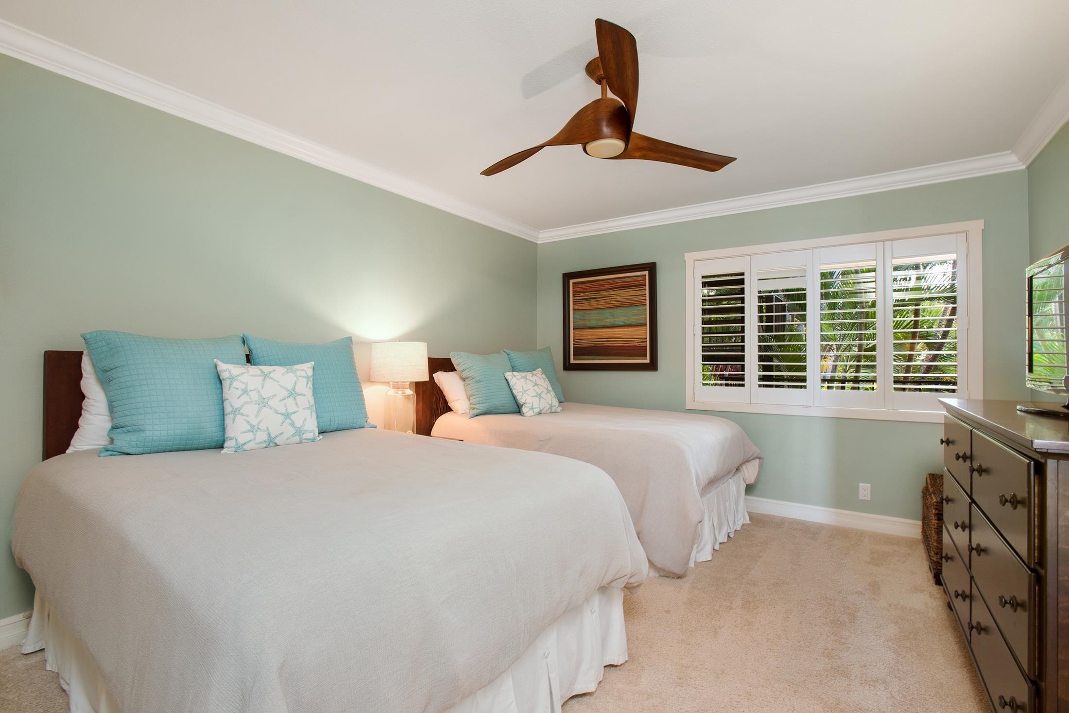 4850 Makena Alanui Road, Unit F207 Kihei, HI 96753 - Photo 18 of 34 a bedroom with a large bed and a large window