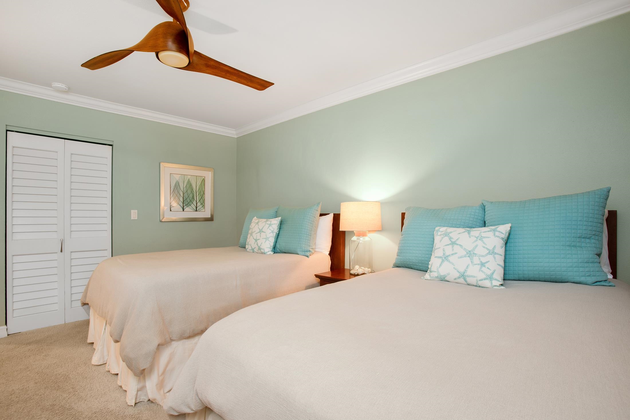 4850 Makena Alanui Road, Unit F207 Kihei, HI 96753 - Photo 19 of 34 a bedroom with a bed and a painting