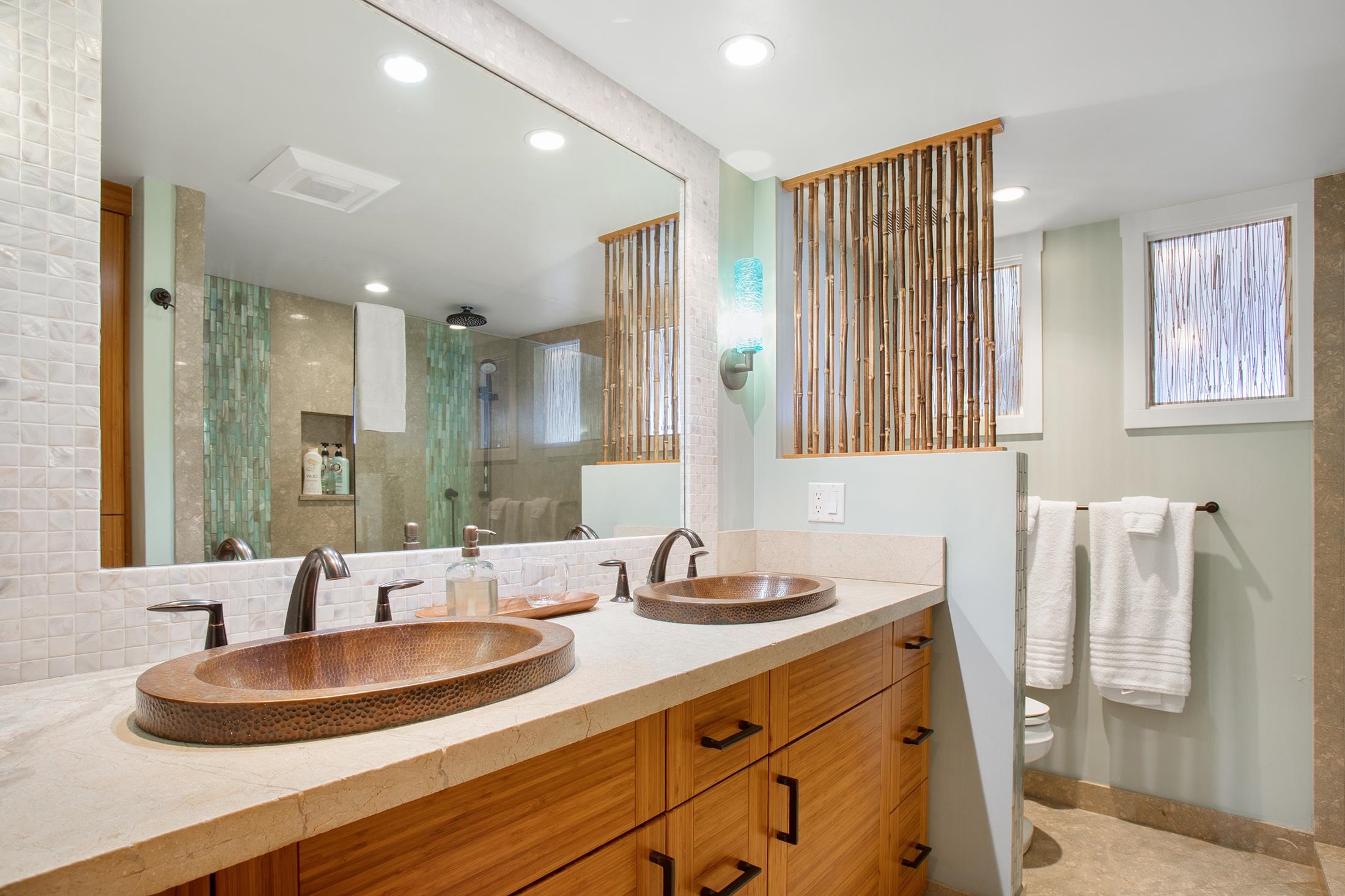 4850 Makena Alanui Road, Unit F207 Kihei, HI 96753 - Photo 20 of 34 a bathroom with a double vanity sink and a mirror