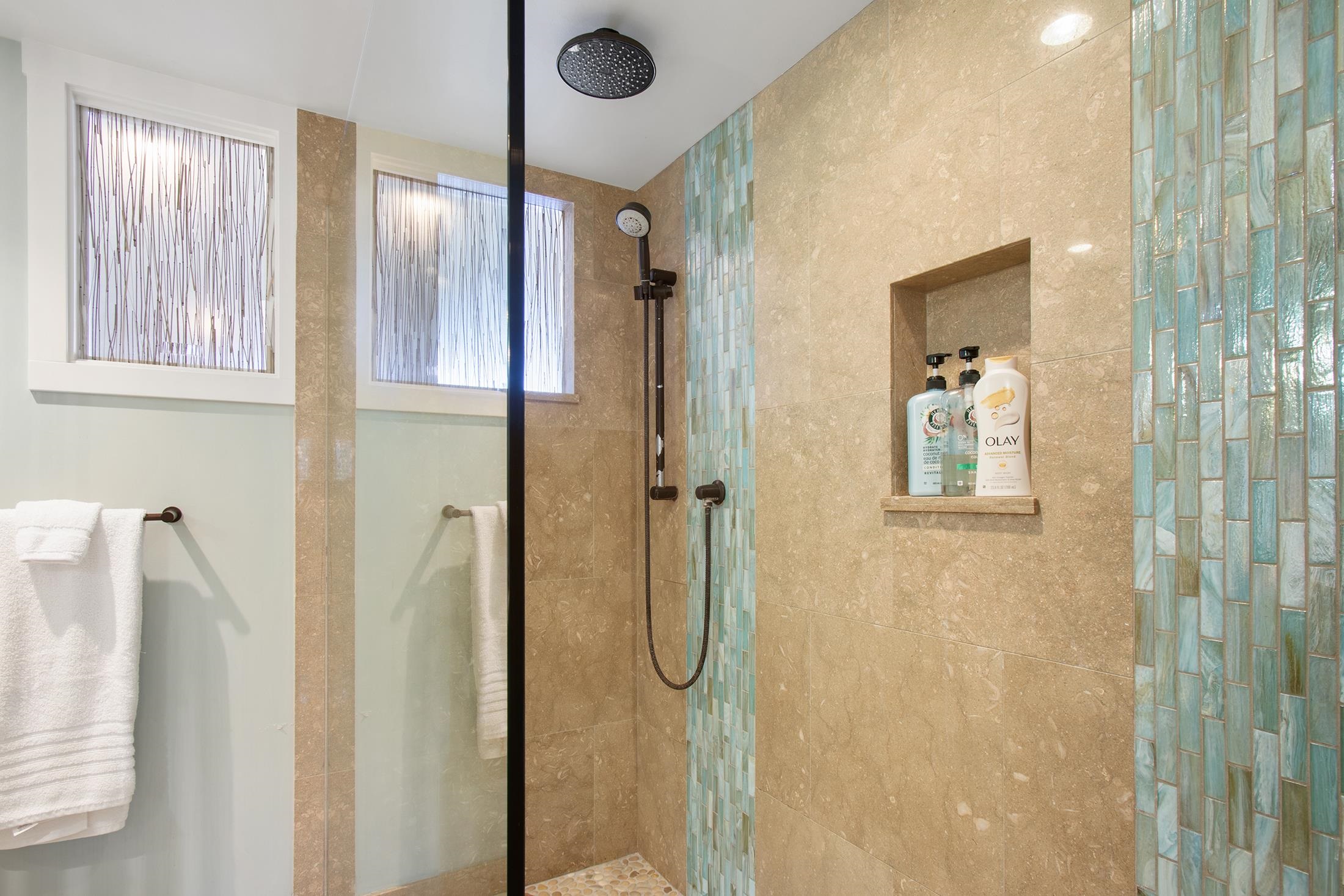 4850 Makena Alanui Road, Unit F207 Kihei, HI 96753 - Photo 21 of 34 a bathroom with a glass shower door
