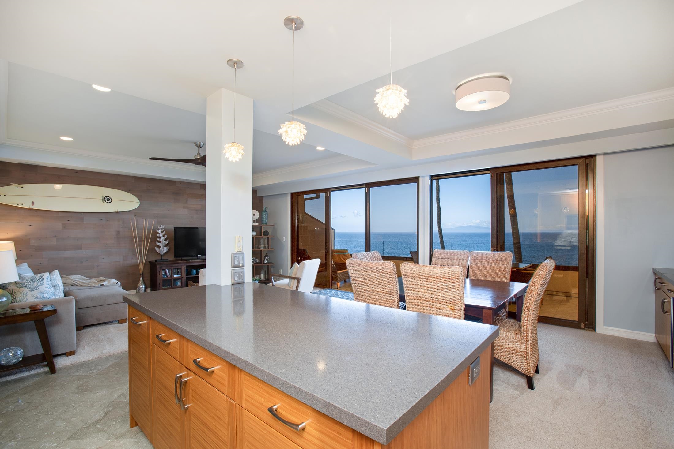 4850 Makena Alanui Road, Unit F207 Kihei, HI 96753 - Photo 6 of 34 a large kitchen with stainless steel appliances a large window and counter space