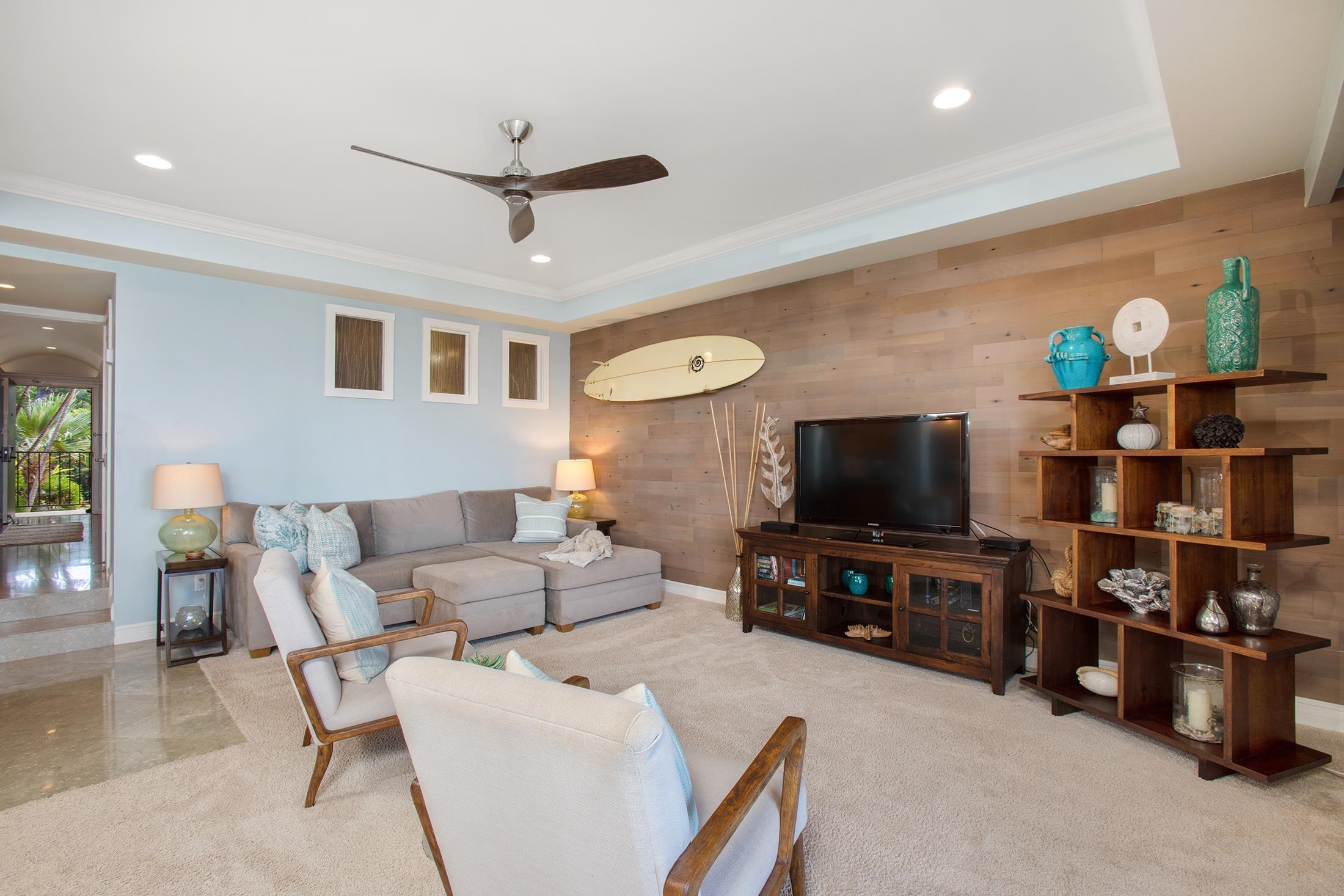 4850 Makena Alanui Road, Unit F207 Kihei, HI 96753 - Photo 8 of 34 a living room with furniture and a flat screen tv