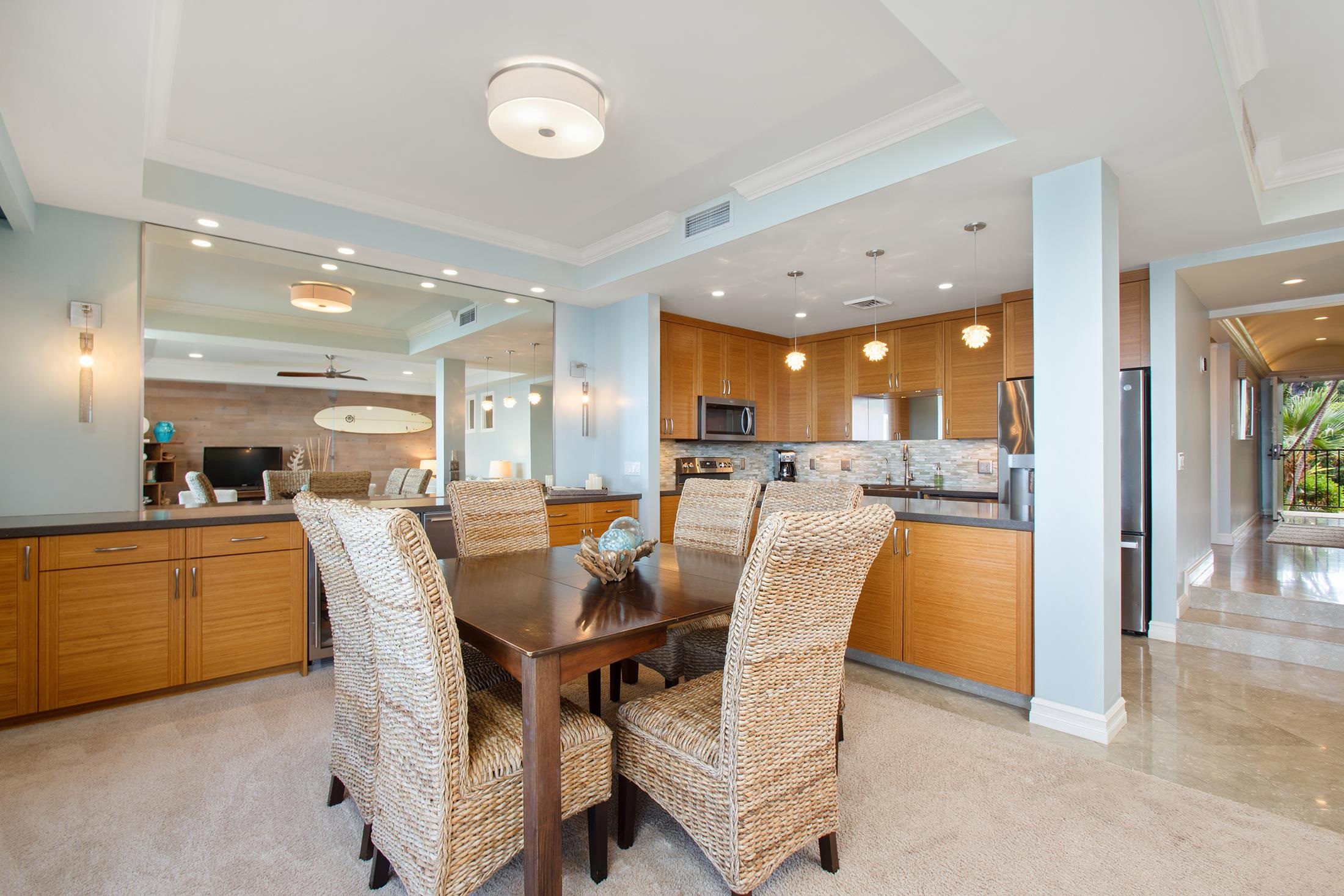 4850 Makena Alanui Road, Unit F207 Kihei, HI 96753 - Photo 9 of 34 a dining area with stainless steel appliances kitchen island granite countertop a table and chairs