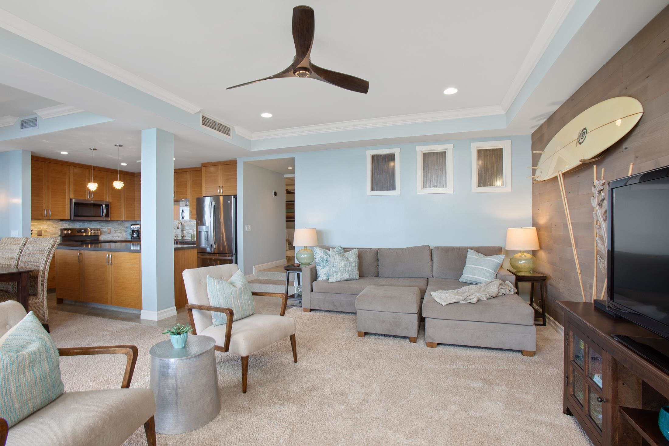 4850 Makena Alanui Road, Unit F207 Kihei, HI 96753 - Photo 10 of 34 a living room with furniture and a flat screen tv