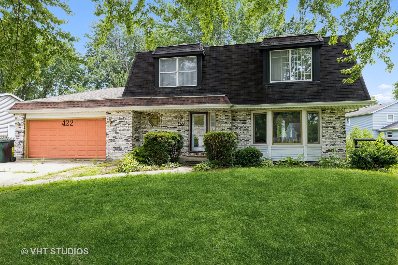 front view of a house with a yard