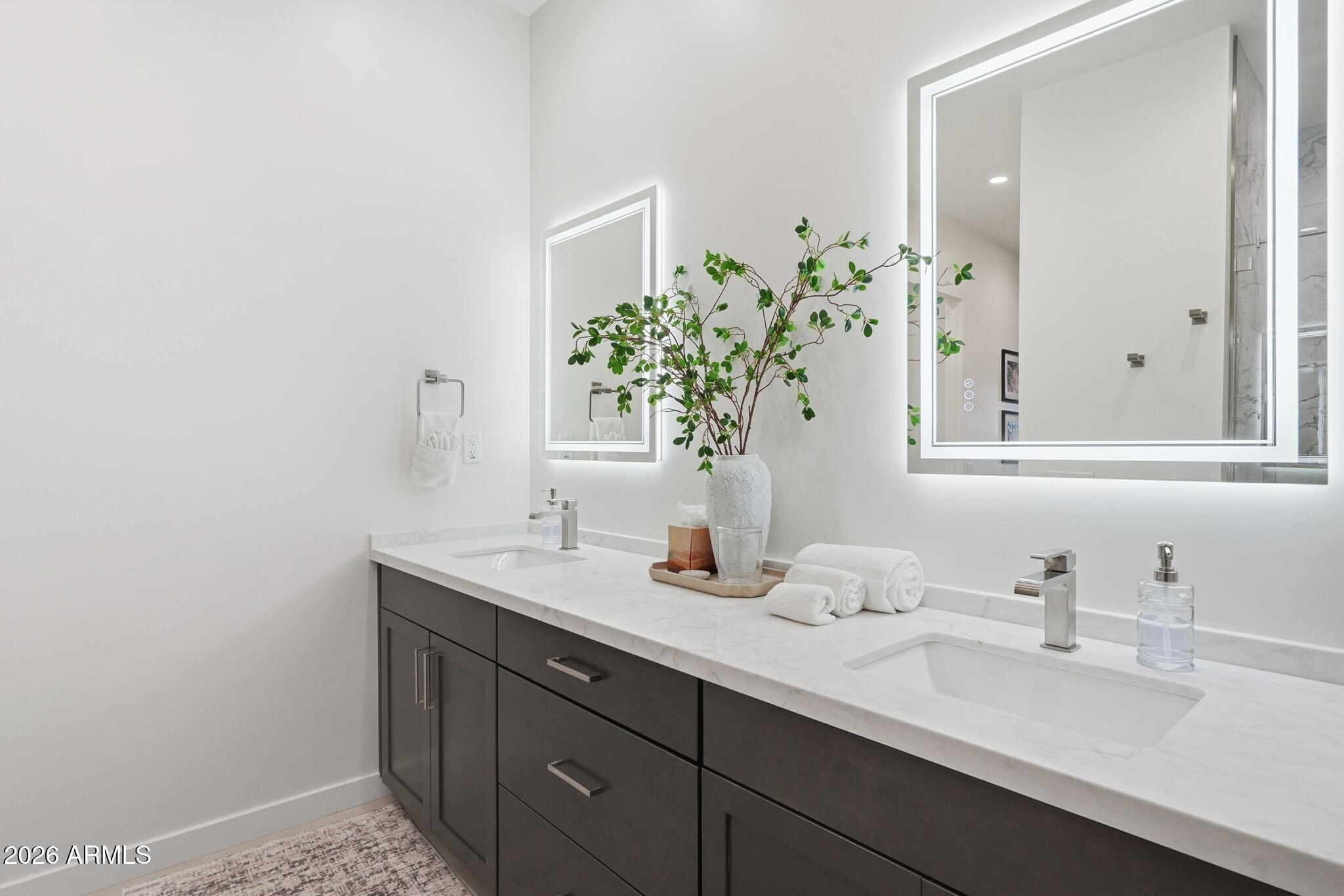 6525 East Cave Creek Road, Unit 304 Cave Creek, AZ 85331 - Photo 17 of 31 a bathroom with a sink and a mirror