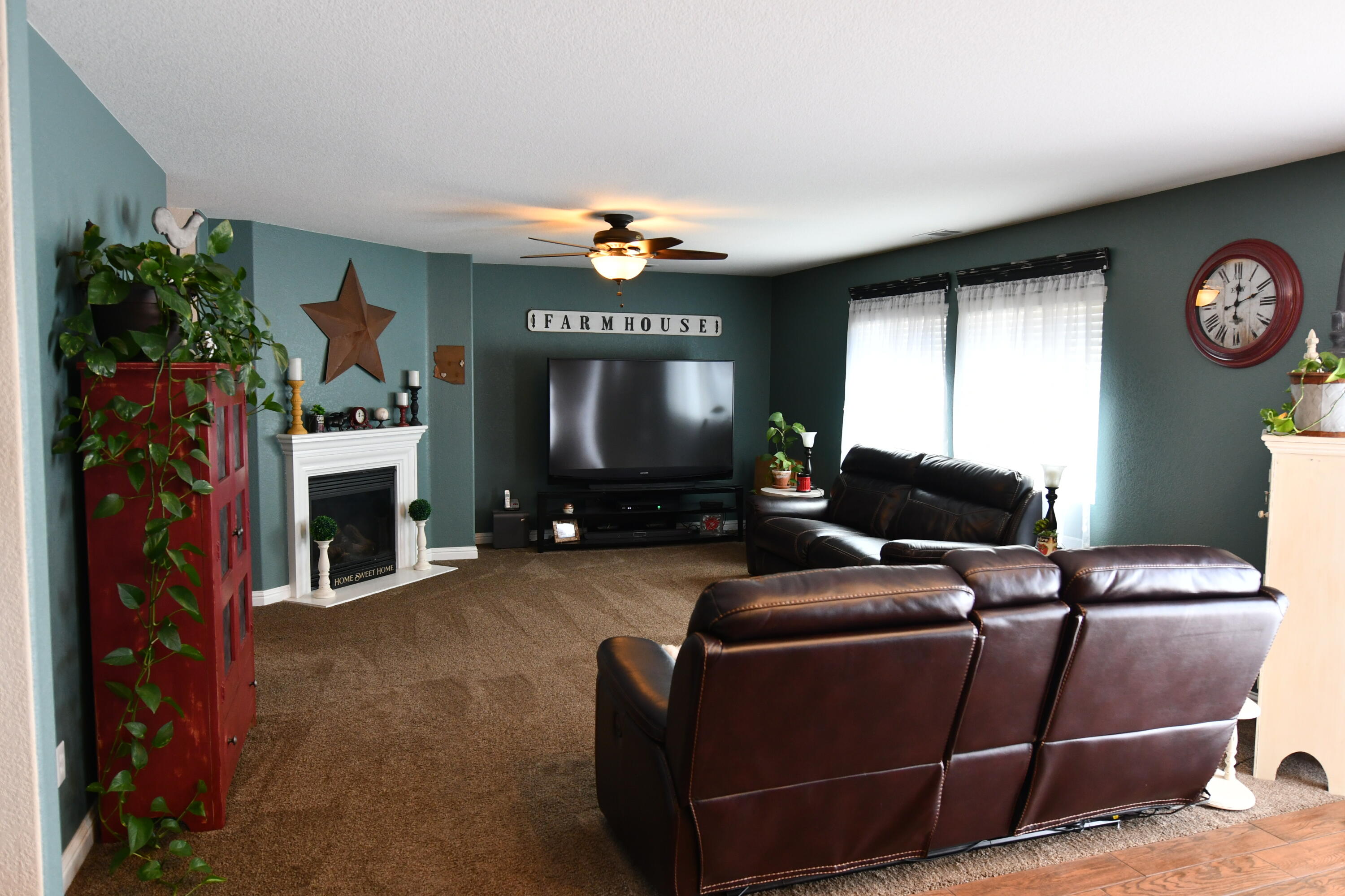 2316 Point Sal Loop Lompoc, CA 93436 - Photo 12 of 36 a living room with furniture a fireplace and a flat screen tv