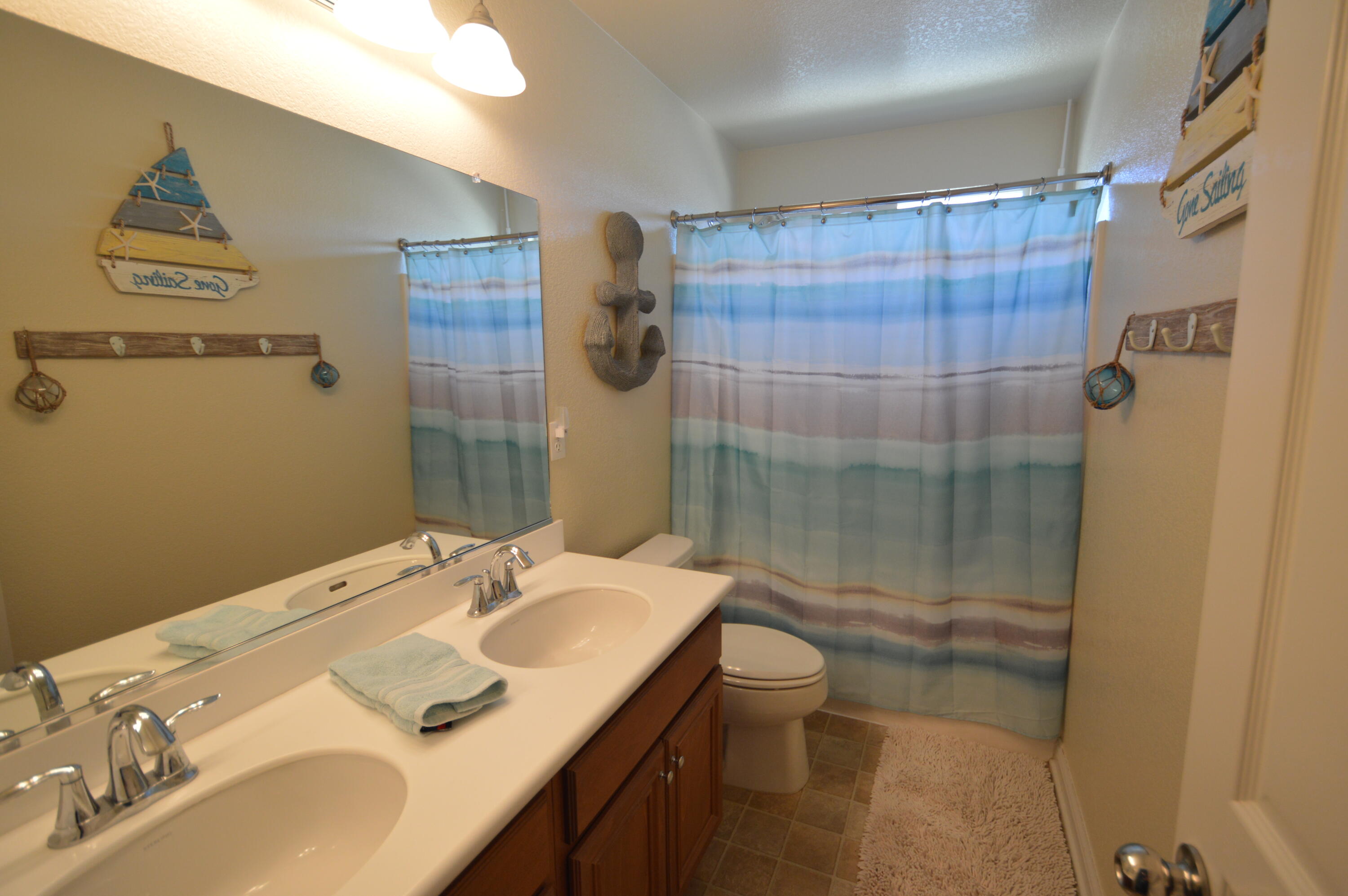 2316 Point Sal Loop Lompoc, CA 93436 - Photo 21 of 36 a bathroom with a sink toilet and shower