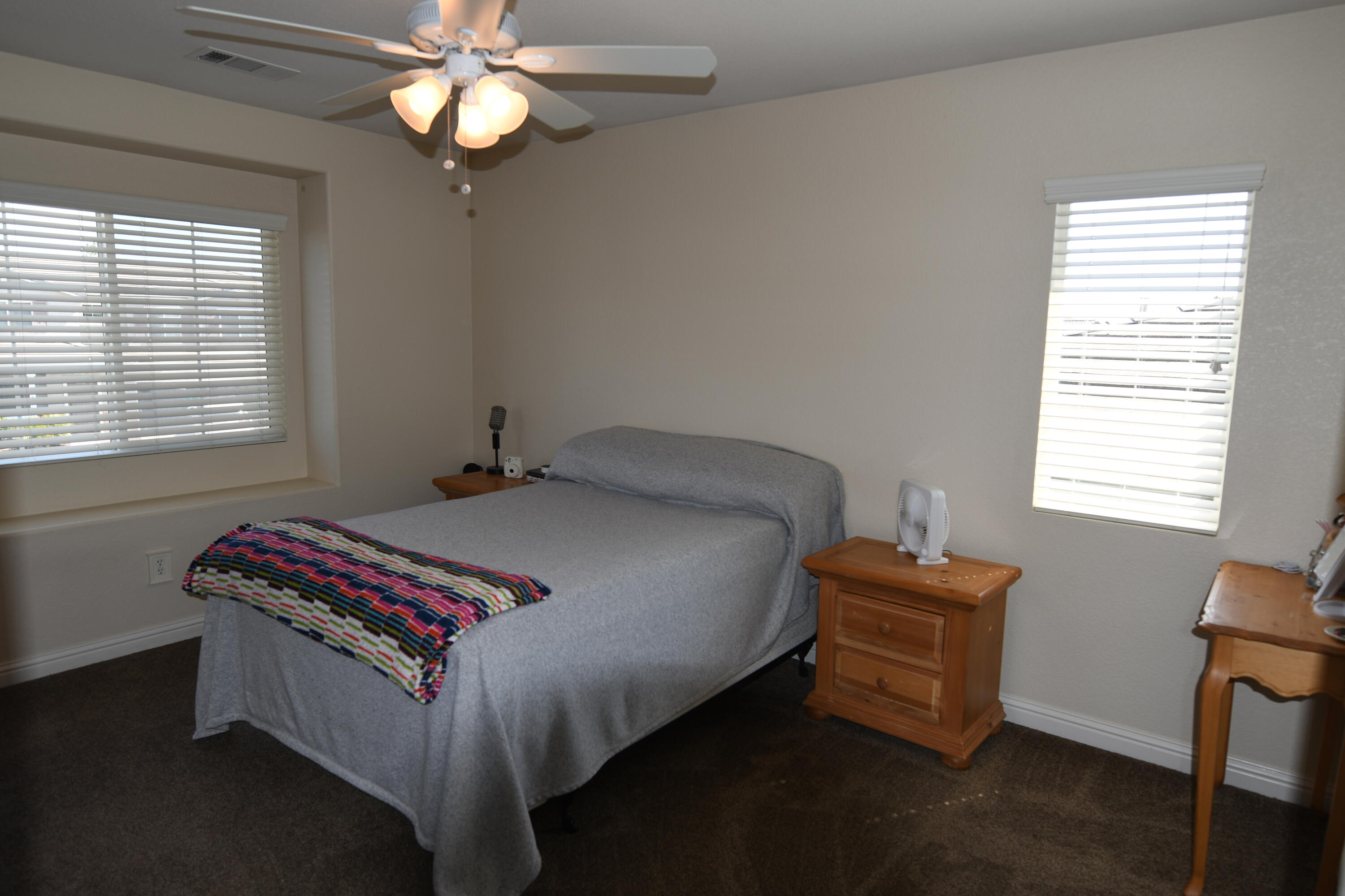 2316 Point Sal Loop Lompoc, CA 93436 - Photo 22 of 36 a bed sitting in a bedroom next to a window
