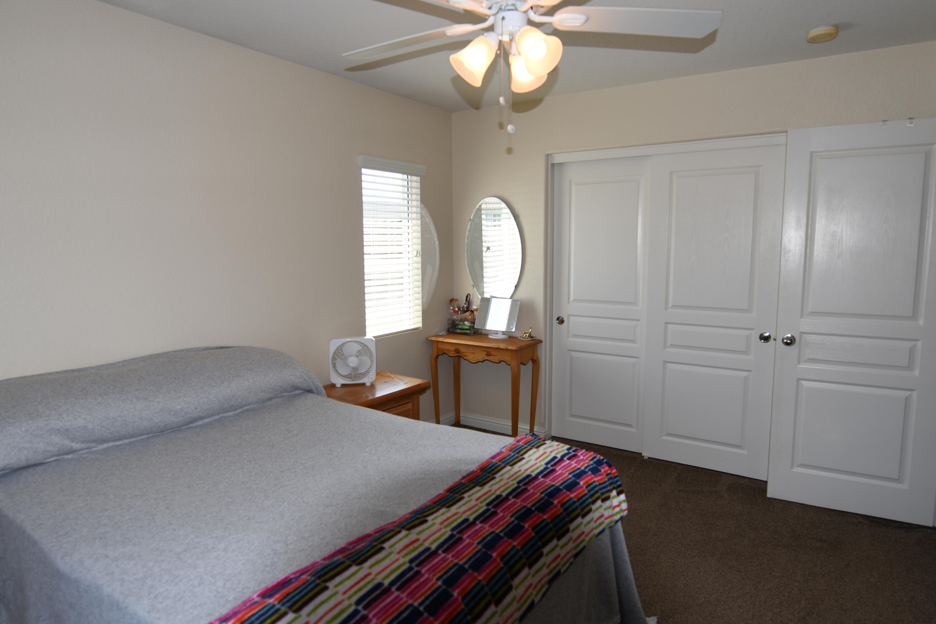 2316 Point Sal Loop Lompoc, CA 93436 - Photo 23 of 36 a bedroom with bed and a chandelier