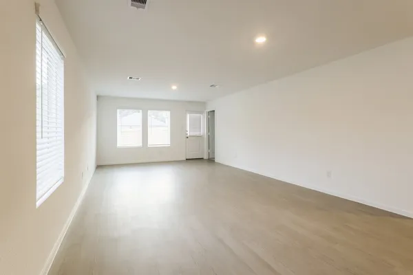 a kitchen with stainless steel appliances and white cabinets