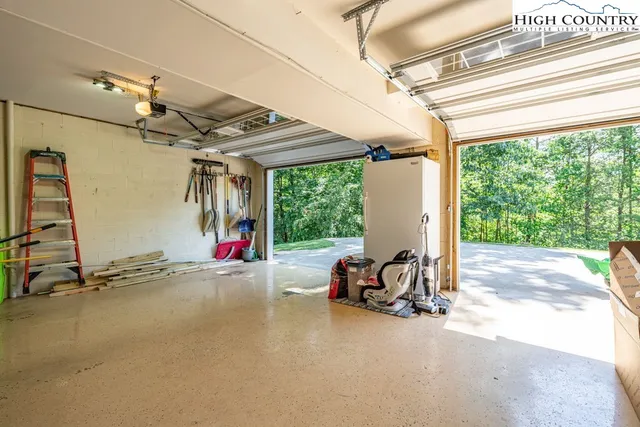 a view of a room with gym equipment and large windows