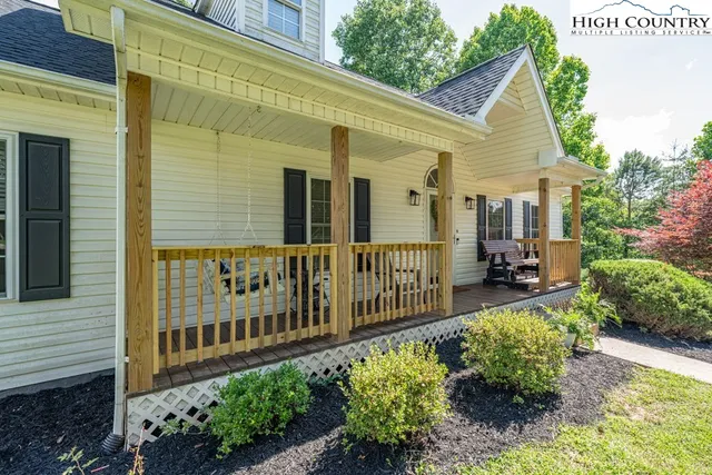 a view of a chair and tables in the balcony