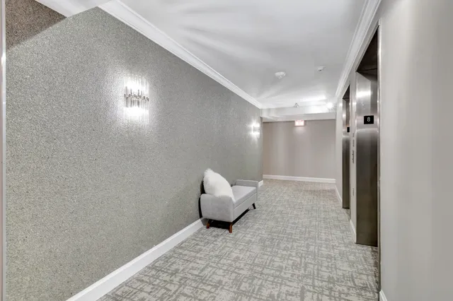 a view of a hallway with elevator