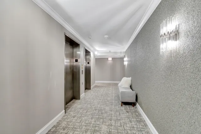 a kitchen with stainless steel appliances granite countertop a refrigerator a sink dishwasher a stove and a refrigerator