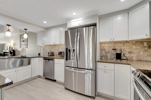a kitchen with a stove and a microwave