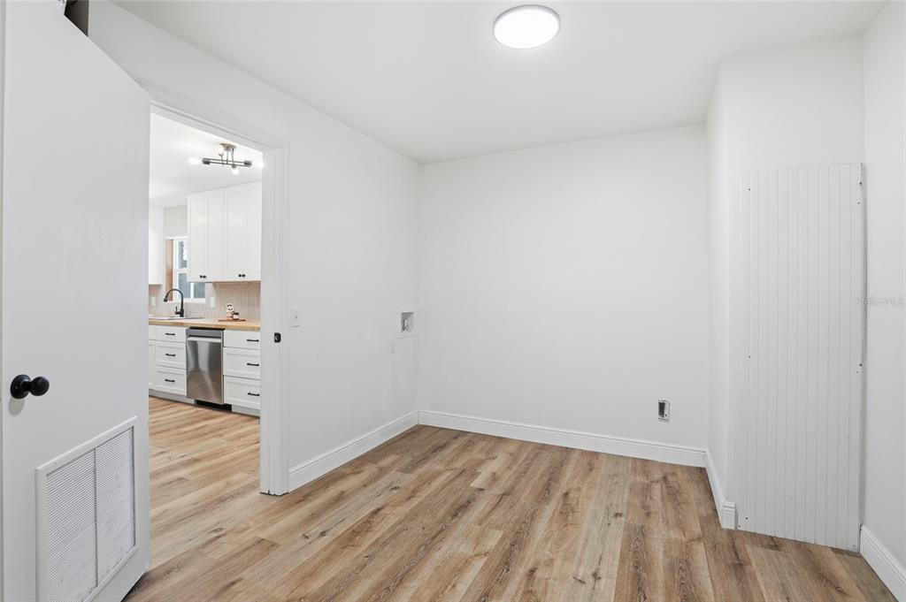 980 Southwest 105th Street Trenton, FL 32693 - Photo 14 of 43 a view of a kitchen with wooden floor and a sink